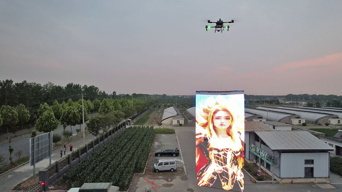 drone <a href=https://www.royaladtek.com/Drone-Light-Show-LED-Mesh-Fabric-p.html target='_blank'>flying display</a> case